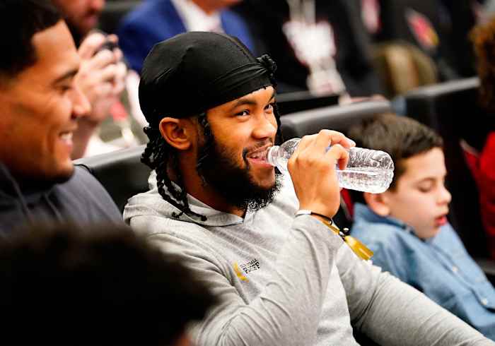 Kyler Murray watches Jonathan Gannon's introductory press conference